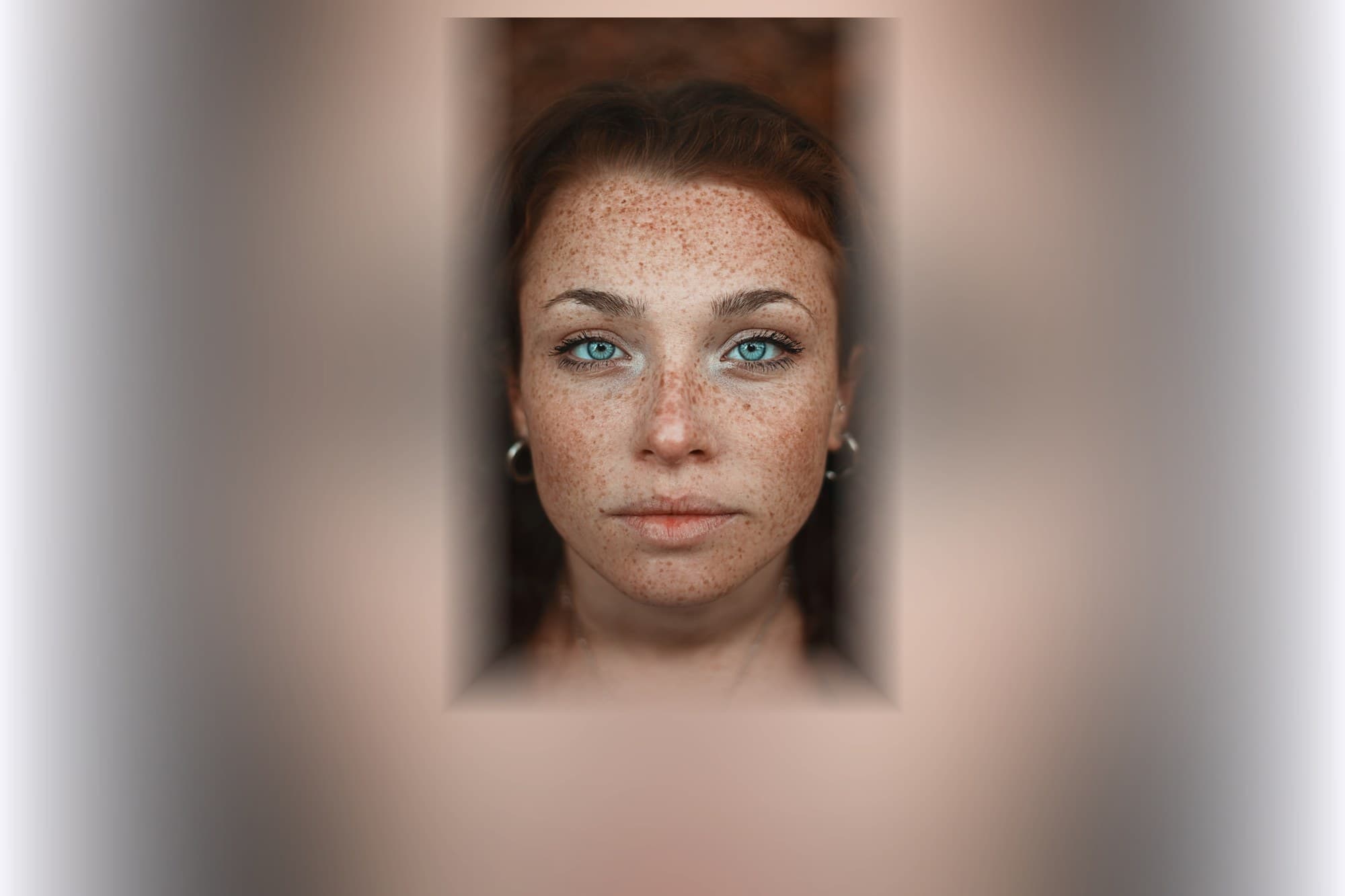Close portrait of a woman with freckled skin